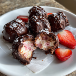 Chocolate-covered strawberry yogurt clusters topped with sea salt and fresh strawberry slices.
